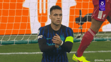 a soccer player wearing a jersey that says inter on it