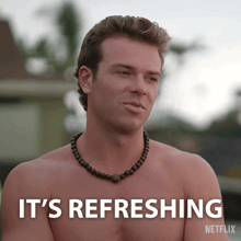 a shirtless man with a necklace and the words it 's refreshing