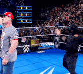 a man in a wrestling ring with a sign that says smack down