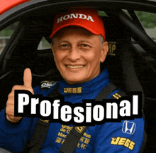 a man in a honda hat gives a thumbs up