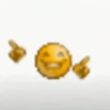 a pixelated smiley face with two thumbs up .