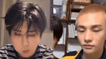 a couple of men are sitting next to each other in a room .