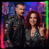 a man and a woman wearing leather jackets with metallica patches