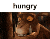 a hungry cartoon character with big teeth