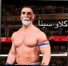 a man without a shirt is standing in a boxing ring with a white face painted on .