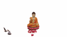 a statue of buddha surrounded by balloons and flowers