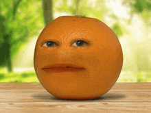 an orange with a face on it sits on a table