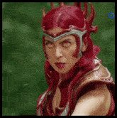 a woman with red hair is wearing a helmet with horns