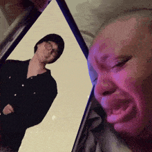 a person holding a cell phone with a picture of a man on it