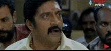 a man with a mustache is making a funny face in front of a video that says volga video on it