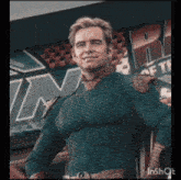 a man in a superhero costume is smiling in front of a sign that says r.i.f.