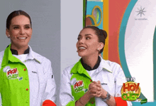 two women wearing green and white jackets with hoy chef on them