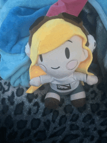 a stuffed toy with the letter n on the shirt