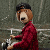 a cartoon bear wearing a black hat that says we 're all gonna be okay