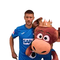 a man in a blue shirt with the word sap on it holds a stuffed animal