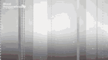 a gray background with a real housewives logo on the bottom