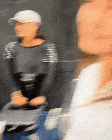 a blurry picture of a woman with margaritosgifs written on the bottom right