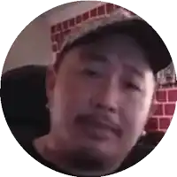 a man with a beard wearing a baseball cap is in a circle