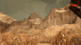 a robot with a blue light on its back is standing in the desert