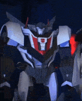 a close up of a robot with a red and white shield on its chest .