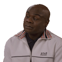 a man wearing a white jacket that says star