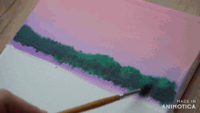 a painting of trees is being painted with a brush and the words made in animotica can be seen in the corner