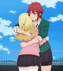 a girl with red hair is hugging a blonde girl