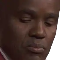 a close up of a man 's face with a white shirt and red tie