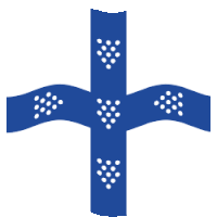 a blue cross with white polka dots on it