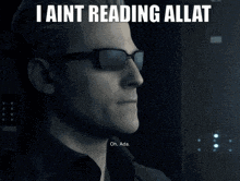 a person is reading a book in a dark room with the words i ain t reading allat