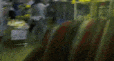 a blurry picture of a group of people walking in a room