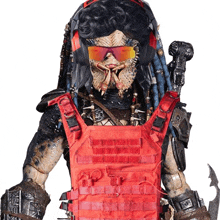 a predator wearing sunglasses and headphones is holding a gun