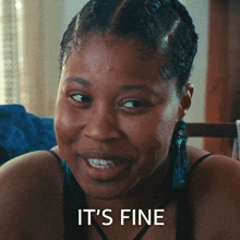 a close up of a woman 's face with the words " it 's fine " above her