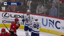 a hockey game is underway and nylander has scored a goal for the toronto maple leafs