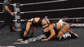 two women are wrestling in a ring with the word vernon written on the floor
