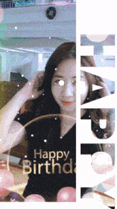 a woman wearing a black shirt that says happy birthday on it