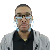 a man with glasses and tears coming out of his face