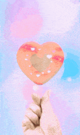 a close up of a woman 's face in a pink heart shaped frame