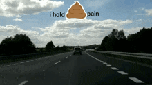 a car is driving down a highway with the words i hold pain written above it