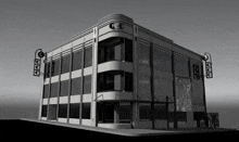 a black and white photo of a large building with a lot of windows on the side of it .
