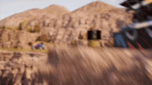 a blurry picture of a person riding a bike down a hill