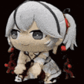 a stuffed toy of a girl with white hair and a ponytail is sitting on a black surface .