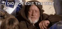 a man with a beard is sitting next to a r2d2 robot in a star wars scene .
