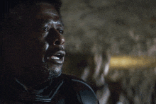 a blurry picture of a man with the words who is it