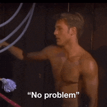 a shirtless man says " no problem " in front of a ring