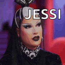 a drag queen with the name jessi above her