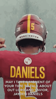 the back of a football player wearing a jersey that says daniels on it .