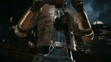 a man in a superhero costume is holding two guns