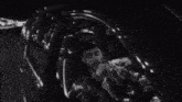 a man and a woman are sitting in a car .