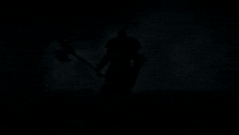 a knight in gold armor is standing in front of a black background